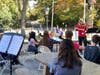 Port Jefferson School District orchestra teacher Dr. Vanessa Salzman led students in song.