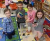Chase D'Annunzio, Samuel Sharipov, Mackenzie Wood, Sasha Rosenthal get up close to hold and check out how the chicks are growing.