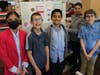 ALT Fifth-grade students from left to right: Mehreen Hussain, James Dowd, Eshaan Patel, Nabhya Yadav, and Kelly Bocket-Matthews present their tri-fold board to the judges.