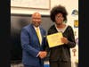 Commissioner Steven R. Mullins presents the "Commissioner Mullins Youth Leadership Award" to West Haven High School freshman Johnnie Harrison.