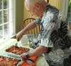John Mack prepares his famous lasagna bolognese.