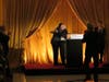 Paul Starker embraces his son, Lee, on stage, as Lee accepts his award