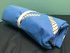 One of the blue wrap sleeping bags donated to SHIP for the city's homeless.