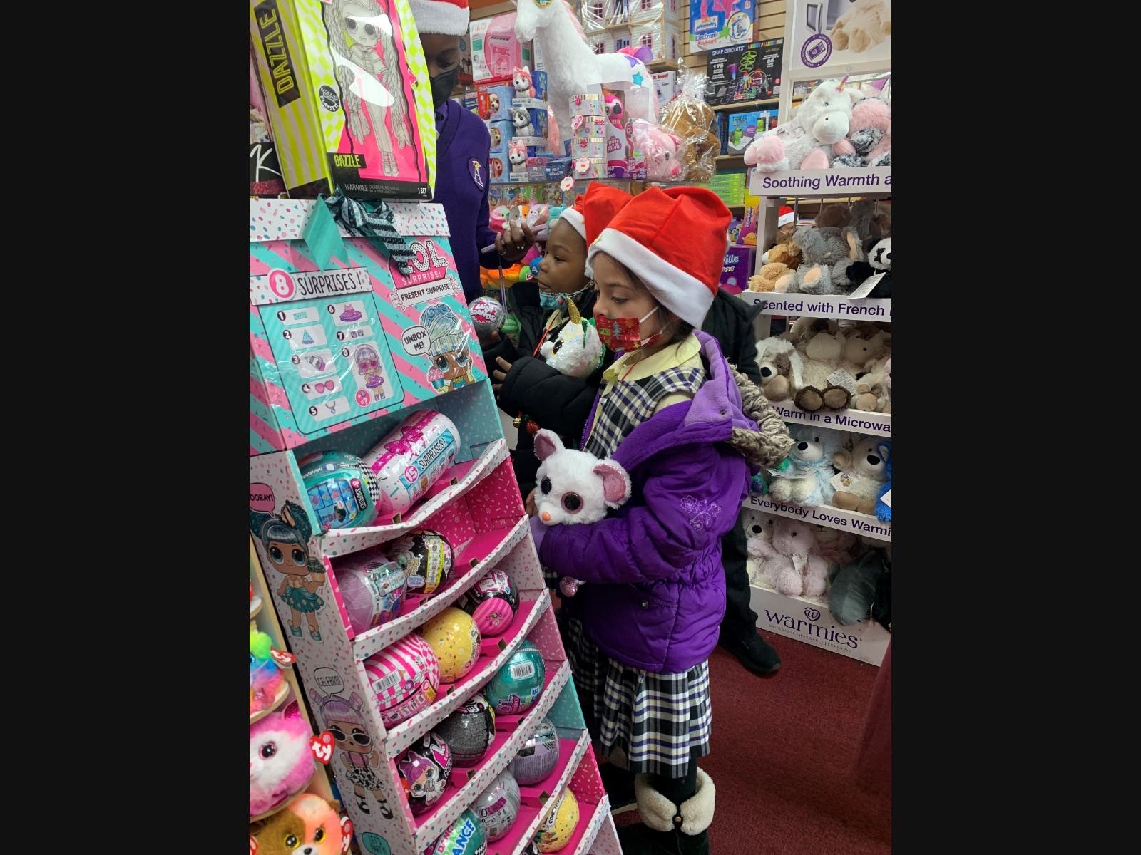 One of fifty students from The Academy Charter School who were the beneficiaries of a morning of  Christmas toy shopping sponsored by Squad Security.