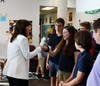 Upon her arrival, Rep. Good shook hands with the attending students, including Caroline Ceaser (as Oakley Clements looks on)