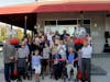WBTT leaders, capital campaign donors, and those involved with the design and construction of the theater renovations participate in the ceremonial ribbon cutting