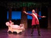 Prince Charming (Earley Dean, foreground) is ever-pleased with himself as Sleeping Beauty (Jai Shanae) sleeps on