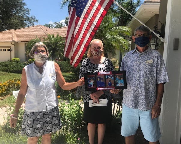 Susan Wood (left) and Tom Faessler (right) of the Wilson-Wood Foundation with Safe Children Coalition’s President & CEO Brena Slater