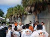 Longtime turkey drive sponsor Dan Dannheisser (center) speaks to the youth volunteers before last year’s turkey distribution