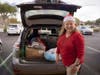 Local DAR member Rebecca Morgan brings backpacks and supplies for homeless veterans to Goodwill as part of the 'Sue's Backpacks' program