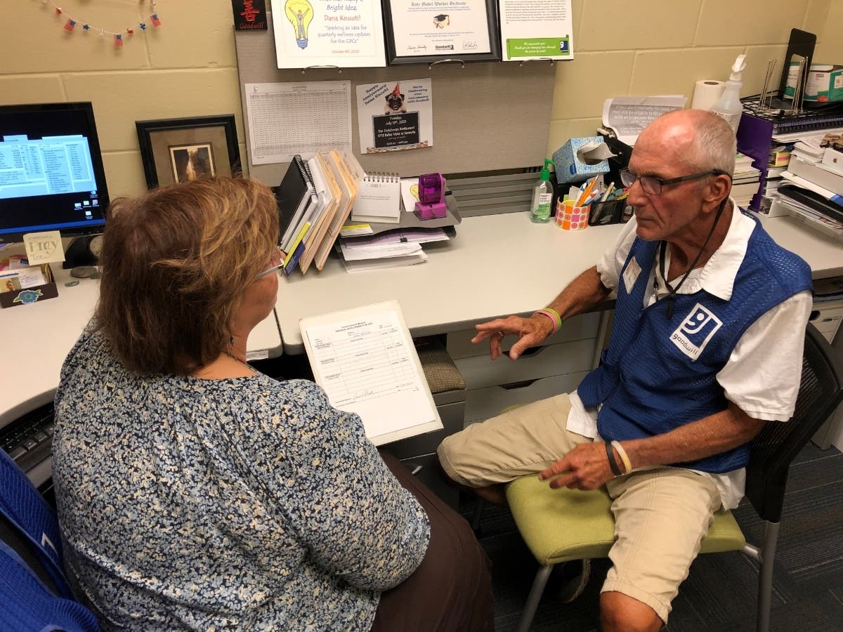 Goodwill Manasota GoodPartner Coach Dana Knuuti (left) with team member Dennis Burton; all Goodwill team members have access to individual coaching to help them achieve life and career success