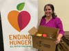 Adeana Osika, director of health and nutrition programs for All Faiths Food Bank, with a Food Rx box