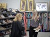 Heather Hale (left) and student Lily McCormack check the racks at the Ranch Lake Goodwill for appropriate interview/job attire