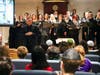 The Choral Artists of Sarasota Artistic Director Joseph Holt speaks to Community Day School students during a performance of ‘The Children’s March’