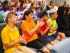 Community Day School students (from l-r) Ethan, Charlie, David and Jensen are fully engaged in the performance of ‘The Children’s March’ by The Choral Artists of Sarasota
