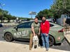 Todd Hughes, program manager for Goodwill Manasota’s American Veterans and Their Families program, with his service dog, Ghost, and Chris De Aguiar, who has started a chapter of Lutz Buddy Up in San Antonio, Texas