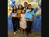 Achievers program graduate Giovanni Roman (back, in suit and tie) and his proud family