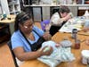 Artists Patty (foreground) and Denise work on ceramic pieces at Happiness House at Easterseals Southwest Florida