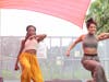 Dancers Monessa Salley (left) and Natalie Aceves during an energetic dance performance on the outdoor stage at the inaugural Juneteenth Arts Festival in 2023