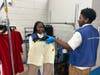 Youth workers Jada and Wadarius work together to get inventory ready for the Goodwill retail sales floor
