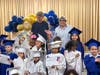 HIPPY program supporters Susan Wood and Tom Faessler of the Wilson Wood Foundation with some of this year’s program graduates