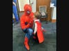 Safe Children Coalition program teams and case managers dressed in superhero costumes and posed for photos with attending families