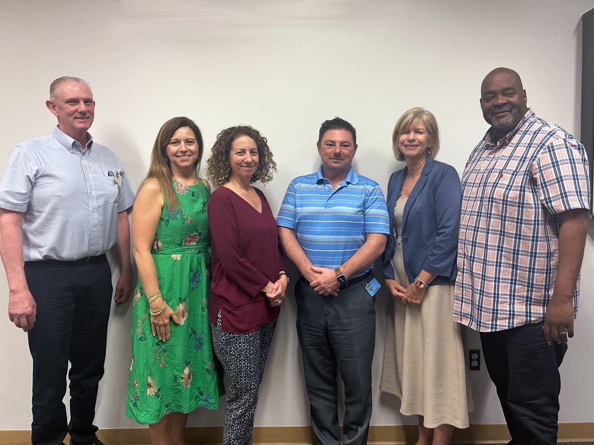 (From l-r) Dan Dean, Ada Cornwall (accreditation team lead), SCC's Senior Director of Contract Administration Jennifer Powers, Jaime Miller, SCC's Chief Operations Officer Robin Jensen, and Ivan Matthew