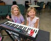 Music Compound campers get ready for a session on keyboards