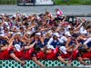 Photo 1: Team USA’s Breast Cancer Paddlers (second team from the bottom, blue jerseys) racing at the International Dragon Boat World Championships in Germany last year