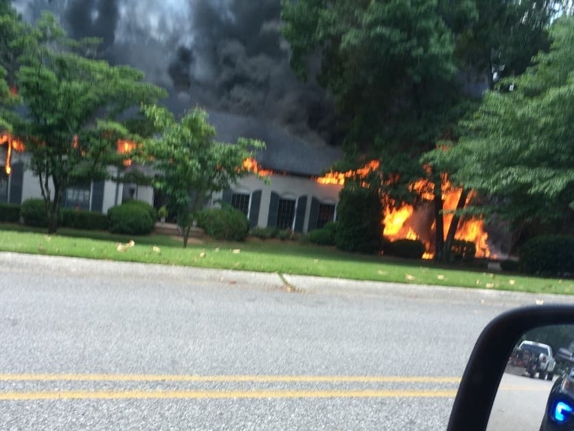 A fire burns at a home on East Briarcliff.