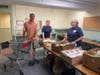 Pantry volunteers Geoff McClain, Joy Faxon and Norma Wright