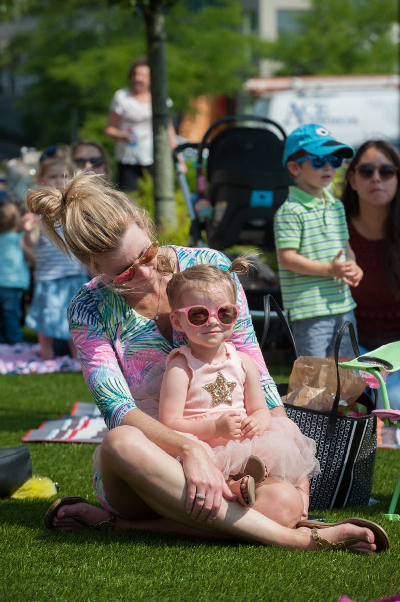Adult and child on the Lawn at Legacy in Dedham.
