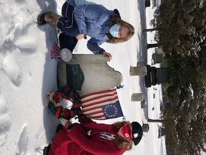 Geri Gendron (L) and Dr. Joan Graham Nathan (R) lay a wreath to Honor Revolutionary War Patriot Captain Austin Roe