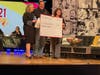 American Momentum Bank presents a check to the rehabilitation center for $4,000. 