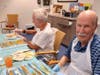 Residents Ira and Bob attend the art classes taught by Ray Auclair