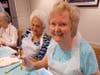 Residents Mary and Carmen attend the art classes taught by Ray Auclair