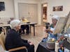 The Watermark at Vistawilla resident Judy Funaro with local muralist Donna Smith