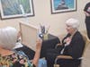 The Watermark at Vistawilla resident Judy Funaro with local muralist Donna Smith