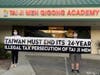 Tai Ji Men dizi hold a banner that reads, “TAIWAN MUST END ITS 24-YEAR ILLEGAL TAX PERSECUTION OF TAI JI MEN,” in front of the Tai Ji Men Qigong Academy in Cupertino, California on August 15, 2020.