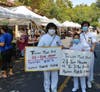 Tai Ji Men dizi bring their family to protest for their rights in a farmers’ market in Claremont, California on August 16, 2020. 