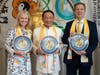 Dr. Katrina Swett, president of the Lantos Foundation for Human Rights and Justice, left, and former U.S. Ambassador-at-Large for IRF Sam Brownback, right, are presented with the Compass Clock of Conscience by Dr. Hong, Tao-Tze, leader of Tai Ji Men.