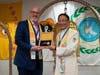 David Curry, president & CEO of Open Doors USA, left, is presented with the “Key to the Heart" by Dr. Hong, Tao-Tze, leader of Tai Ji Men, after ringing the Bell of World Peace and Love. The key symbolizes that conscience is the key to peace and freedom.