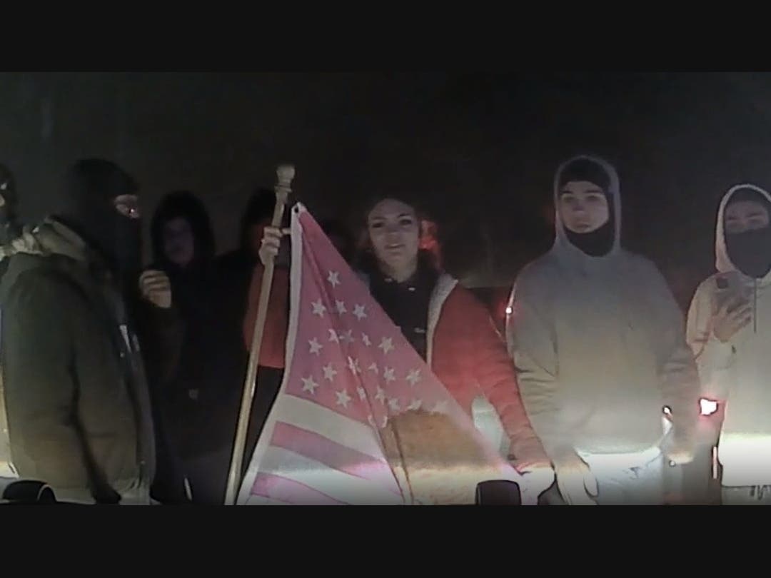 Police are seeking to identify a group of people accused in a street takeover in which a police officer was attacked. 