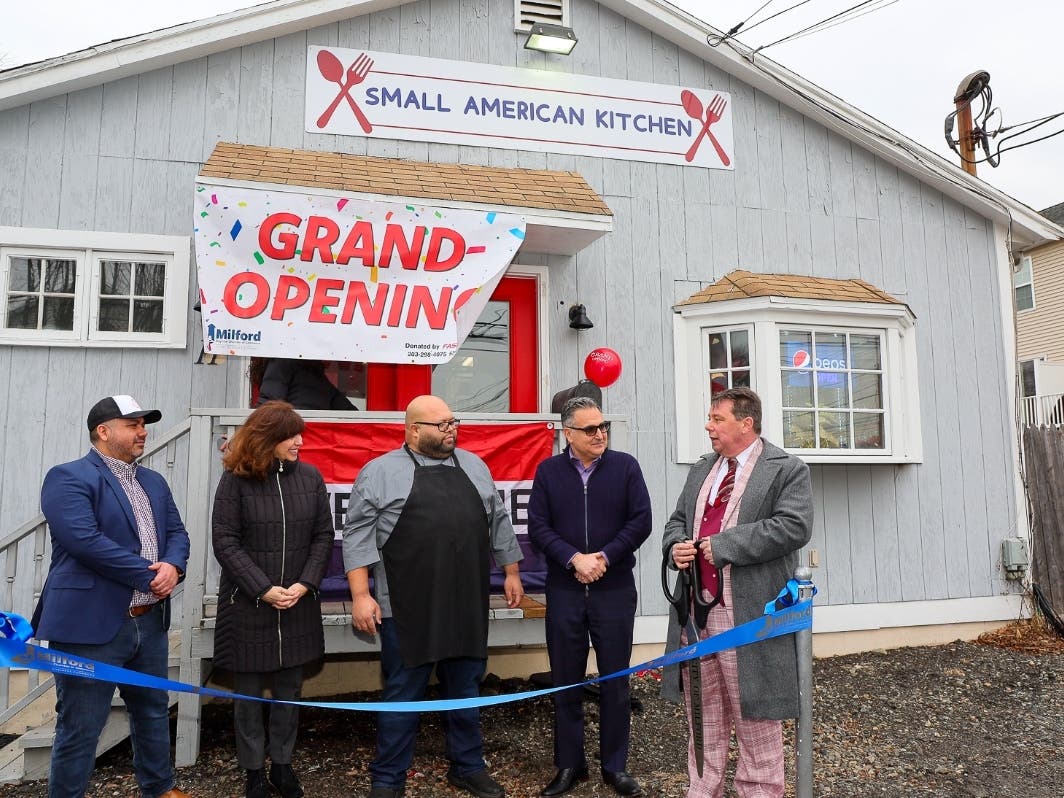 (L-R Owner Alvaro Giron, City Clerk Karen Fortunata, Owner Chef Alberto Baez, Mayor Anthony Giannattasio.) A ribbon-cutting was held recently at Small American Kitchen, a new Milford restaurant. 