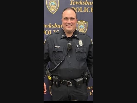 Tewksbury Police Officer Dennis Kelleher helped safely evacuate residents from a burning home on Friday morning. 