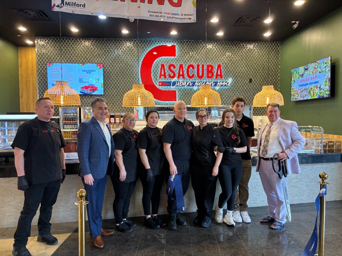 From left to right: Edgar Maldonado, Mayor Tony Giannattassio, Lode Ortiz, Denise Maldonado, Owner Amilcar Samber, Owner Leisy Samber, Gabriella Samber, Christopher Samber.