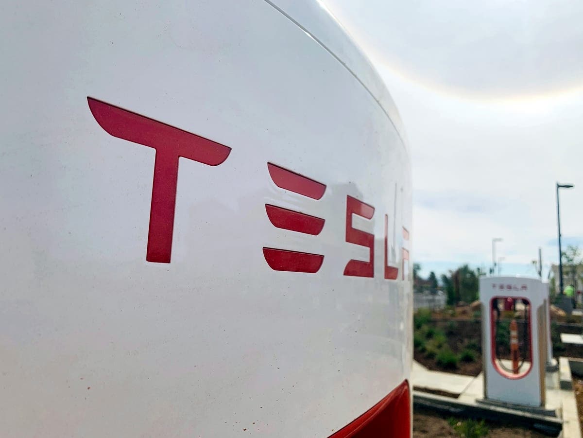 Hundreds of people protested at a Milford Tesla service center over the weekend.