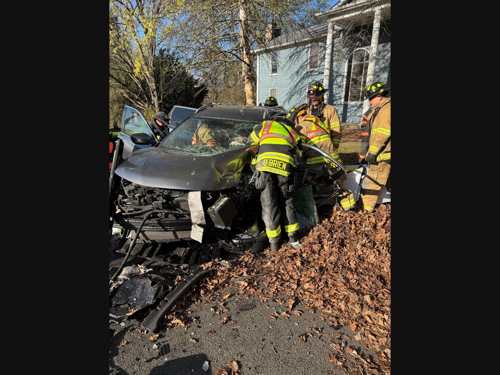 Two people were hospitalized and firefighters had to remove a person trapped in a car following a crash Wednesday. 