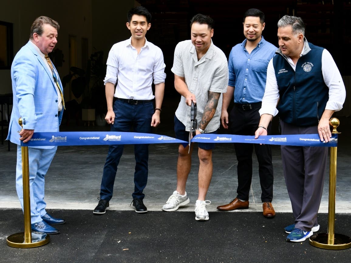 Left to right: Simon McDonald of the Milford Regional Chamber of Commerce; Lin, Vinnie and Chao J & K Cabinetry CT; and Mayor Anthony Giannattasio.