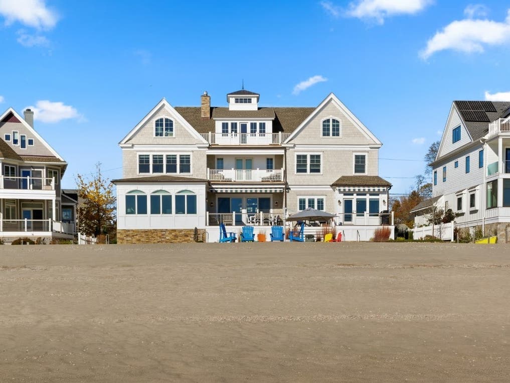 The custom-built five-bedroom home has almost 90 feet of direct sandy beach frontage. 